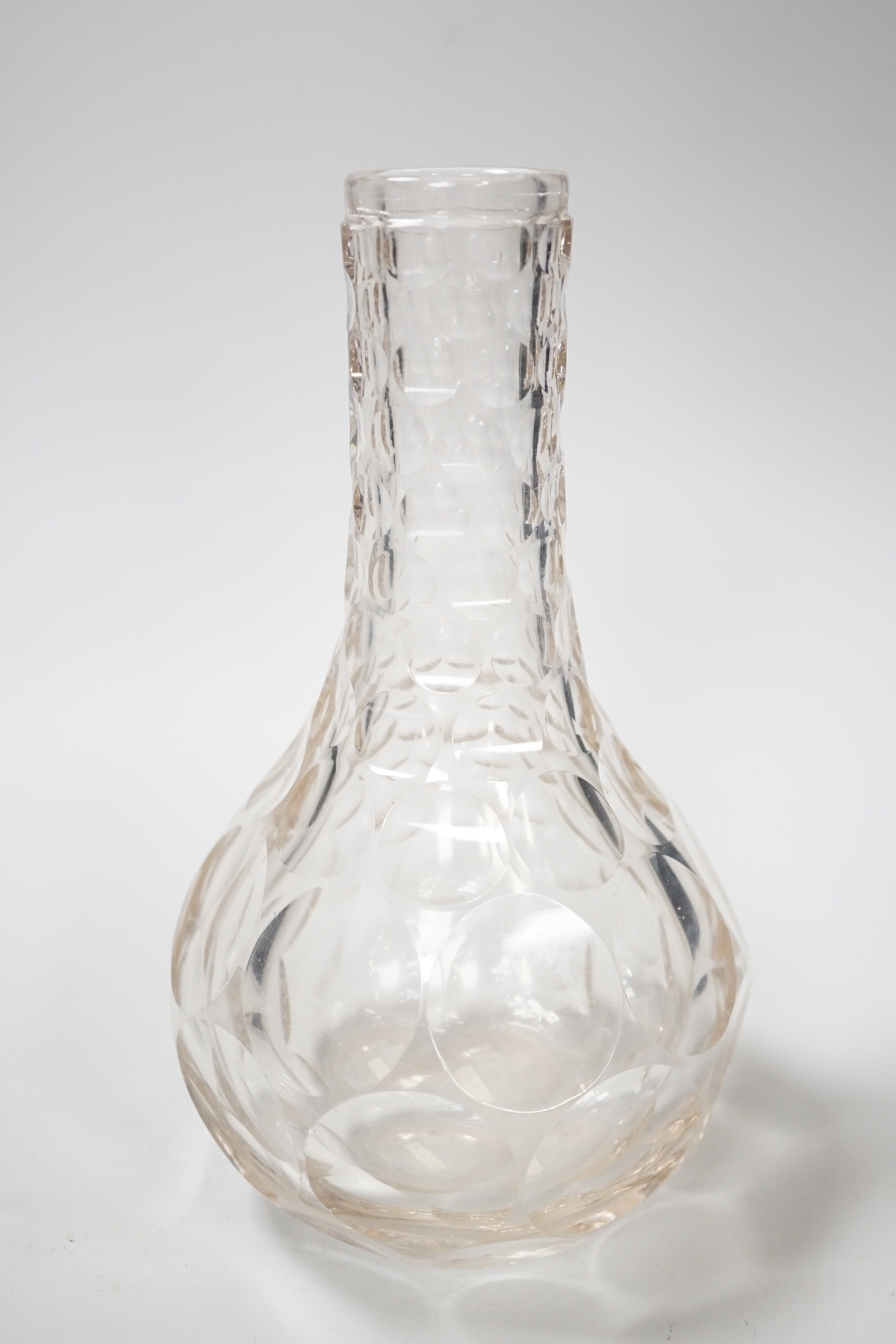 An English lead crystal shaft and globe carafe, decorated throughout with cut roundels or printies, grey dark coloured metal. early 19th century, 23cm high